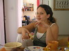 Beth > Anat enjoying Frommer's shuk challah.