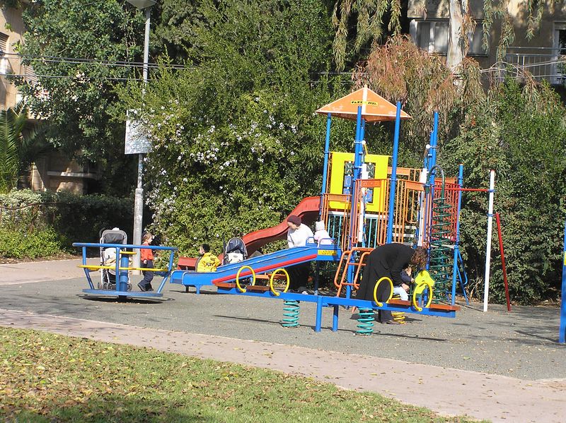 Beth > Walking down my street, we pass by the park - these kids don't waste any time getting to the playground in the morning!