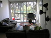 Beth > Our living room, and the doorway out to our balcony.