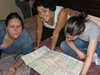 Beth > Barcelona, at our feet . . . if only we could understand the map.