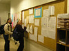 Beth > Dalia, Rachel and the student bulletin board.