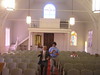 Beth > The inside of the synagogue, view from the bimah.  The people in the photo are Steve Liverman, the president of the tiny congregation and my host for my two weeks in Mississippi, his wife Sandra, and their nephew Nathan.