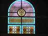 Beth > The whole synagogue had pretty stained glass windows - here's the fanciest, above the choir loft.